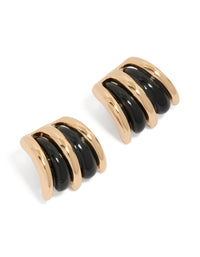 Showcasing stud earrings with double lined design in gold and black front view - link has visual effect only