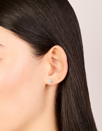 These sterling silver cubic zirconia pear stud earrings on ear view - link has visual effect only