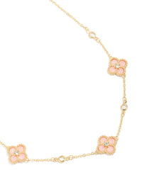 Showcasing a gold plated pink cubic zirconia flower trio necklace with dainty style front view - link has visual effect only