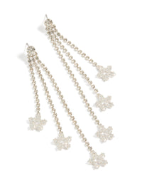 Beautifully crafted diamante triple tassel flower drop earrings featuring charm accents in a statement style front view - link has visual effect only