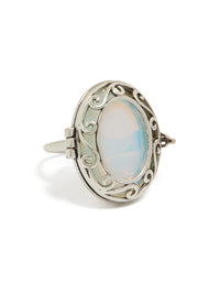 Showcasing an antique silver oval stone locket ring in pale turquoise and statement style front view - link has visual effect only