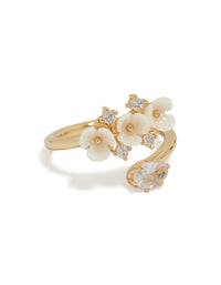 Showcasing a gold plated triple flower wrap ring with statement floral design in ivory and white side detail view - link has visual effect only