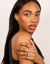 Designed with silver plated cubic zirconia purple oval crystal statement styling on finger view - link has visual effect only