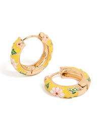 Explore these huggie earrings featuring floral yellow enamel with pink flower and leaf prints in statement gold front view - link has visual effect only