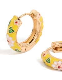 Designed with huggie earrings featuring floral yellow enamel, pink flower and leaf prints in statement gold close up view - link has visual effect only