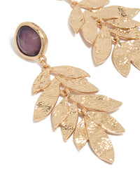 Designed with statement drop earrings featuring purple beads, textured layered petals in gold close up view - link has visual effect only