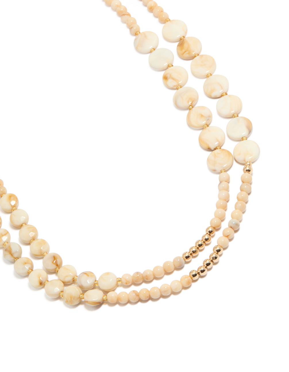 Featuring cream acrylic beaded layered necklace with balls, round stone in beige ivory gold close up view
