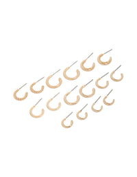 Showcasing thin round hoop earrings in gold 8-pack with varied textures front view - link has visual effect only