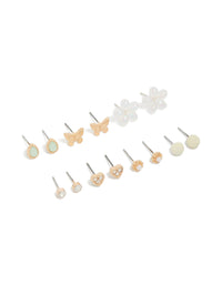Featuring gold diamante and pearl flower earrings in a 7-pack with butterfly details and stud closure front view - link has visual effect only