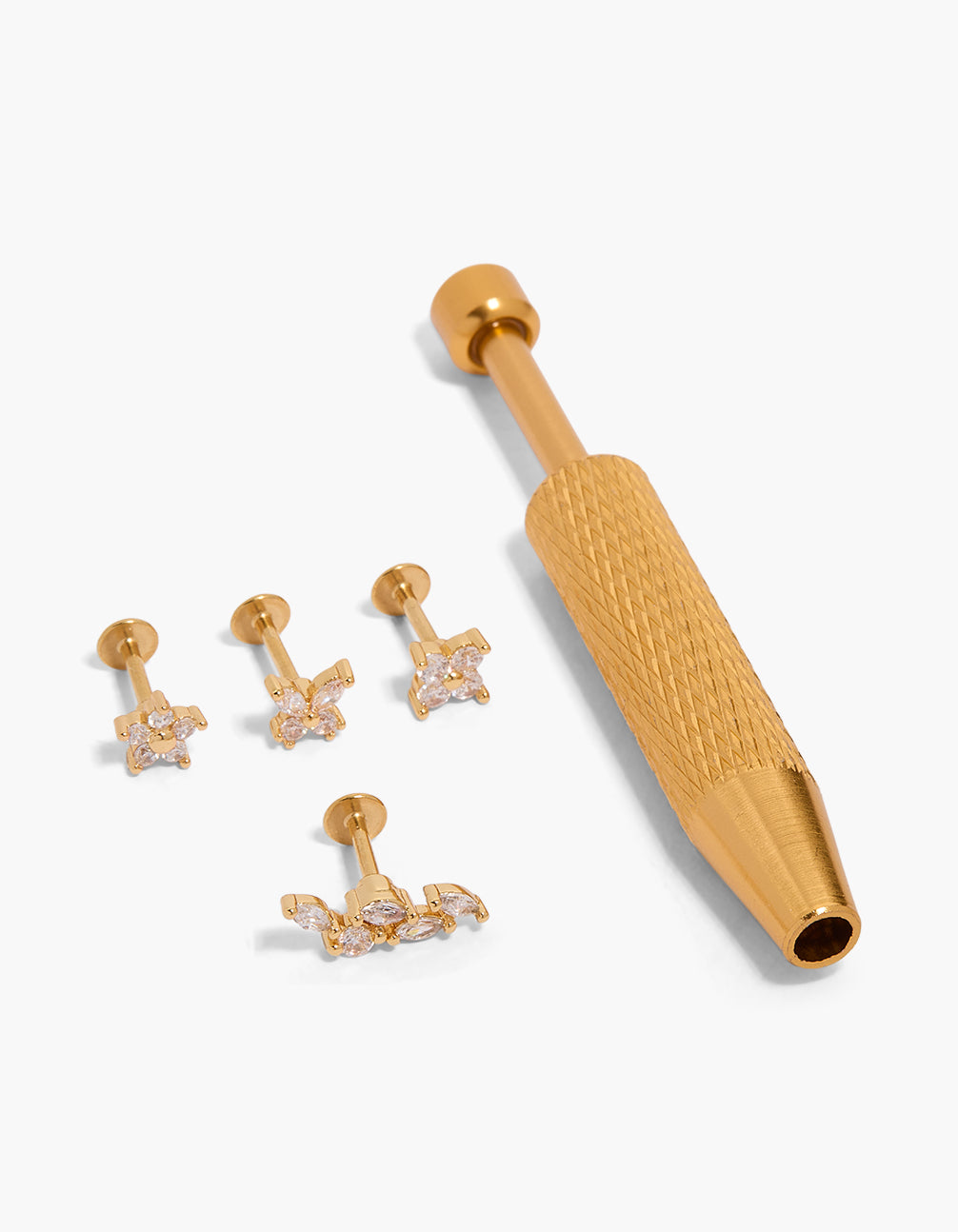 Discover gold plated surgical steel flat back tool and floral vine studs pack featuring cubic zirconia accents front view